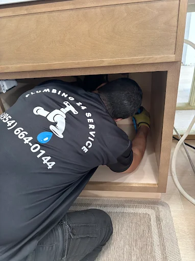 Plumbing 24 Service plumber fixing bathroom sink in Broward County