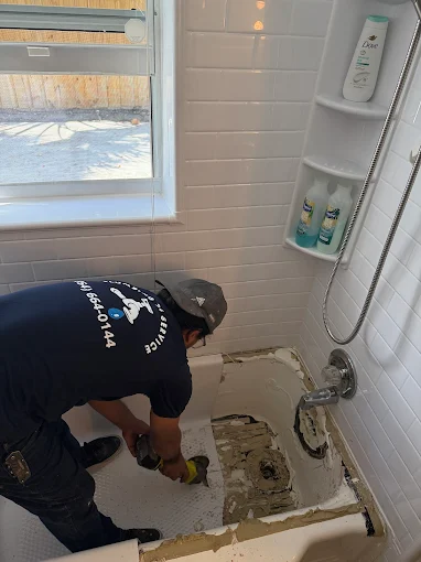 Plumbing 24 Service plumber repairing roof plumbing vent in Broward County